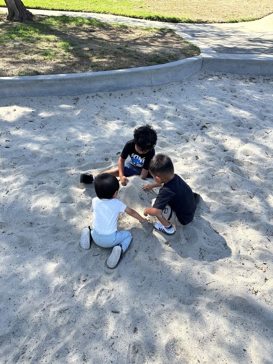 Children playing together in the sandbox