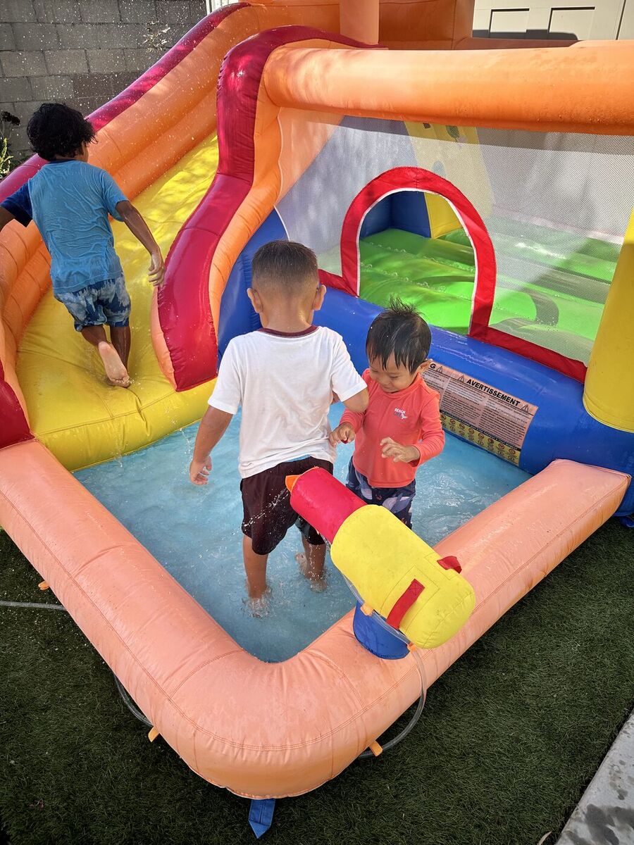 Children in the inflatable water play pool